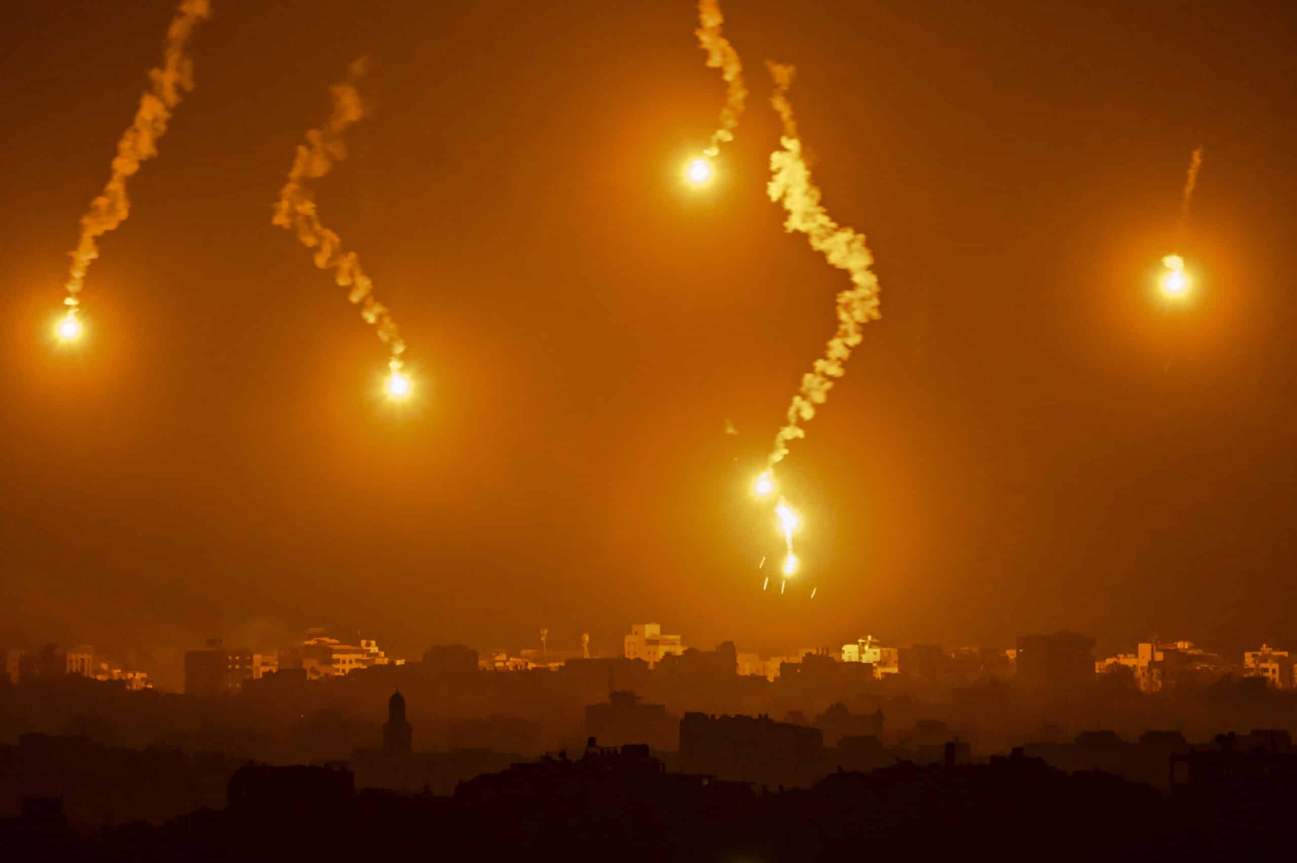 This picture taken from Sderot along the border with the Gaza Strip early on November 5, 2023, shows flares over the Palestinian enclave during an Israeli strike, amid ongoing battles between Israel and the Palestinian Hamas movement.